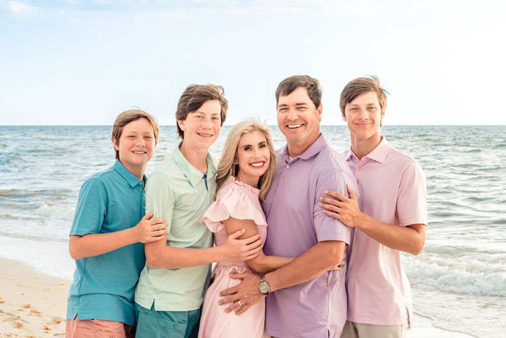 family portrait 6 people at beach colorful outfits and sunset
