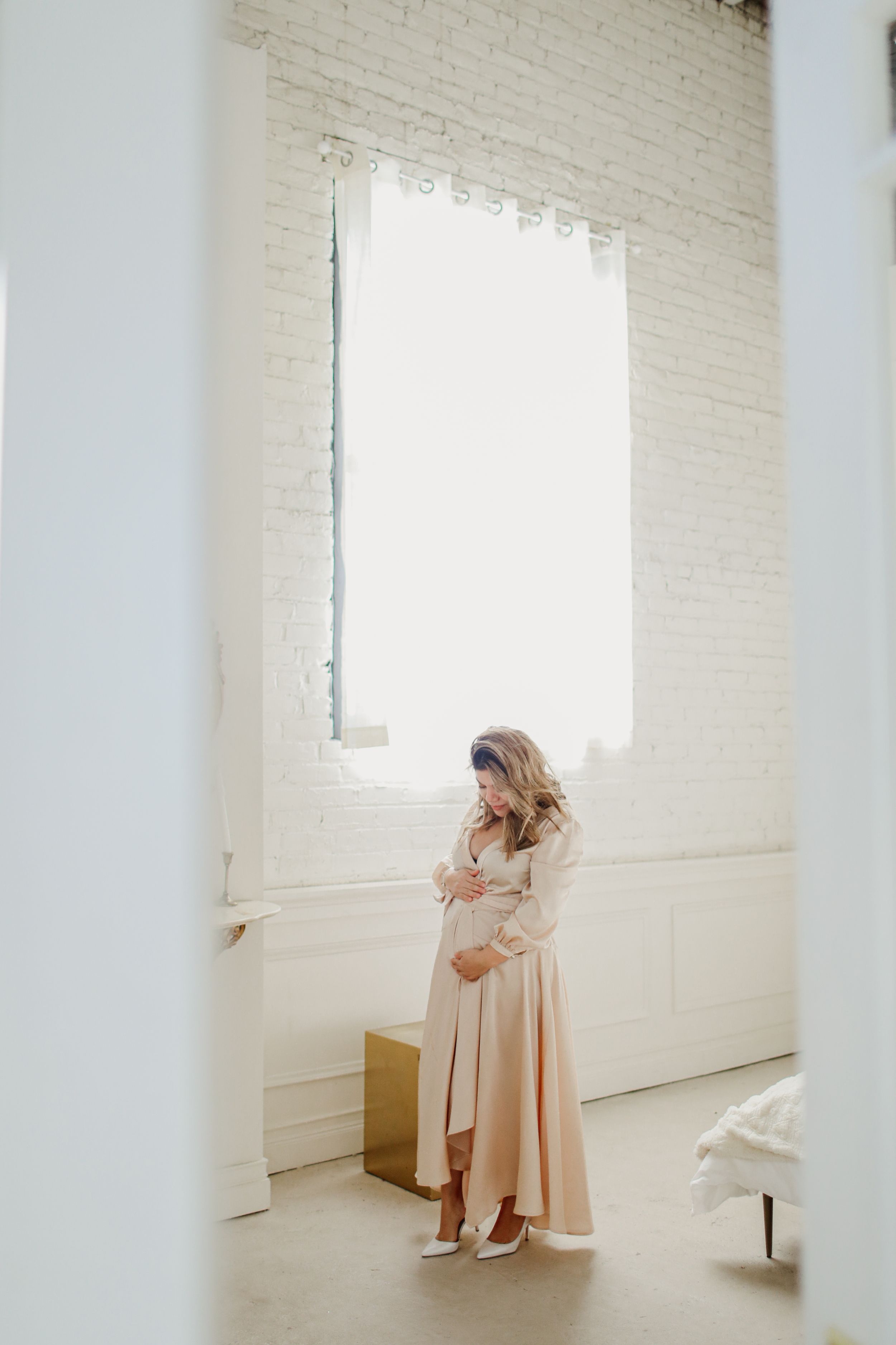 Ethereal photos in a bright white studio space with soft natural window light.