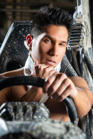 Artistic automotive portrait with dramatic lighting and mechanical elements.