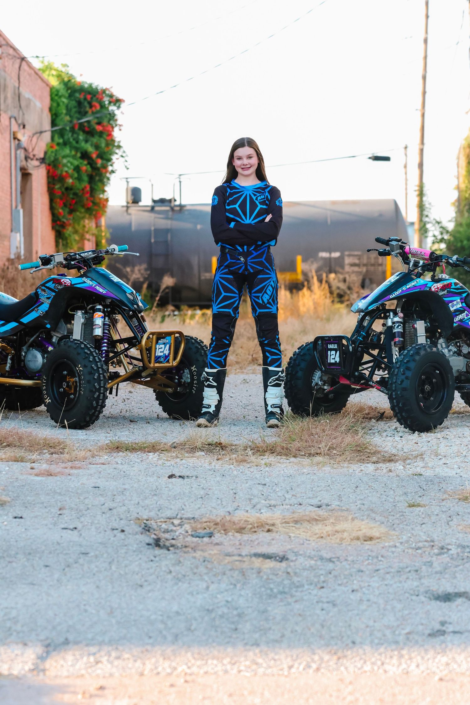 Off-road ATV vehicles lined up in a row on a dirt surface showing different angles and perspectives.