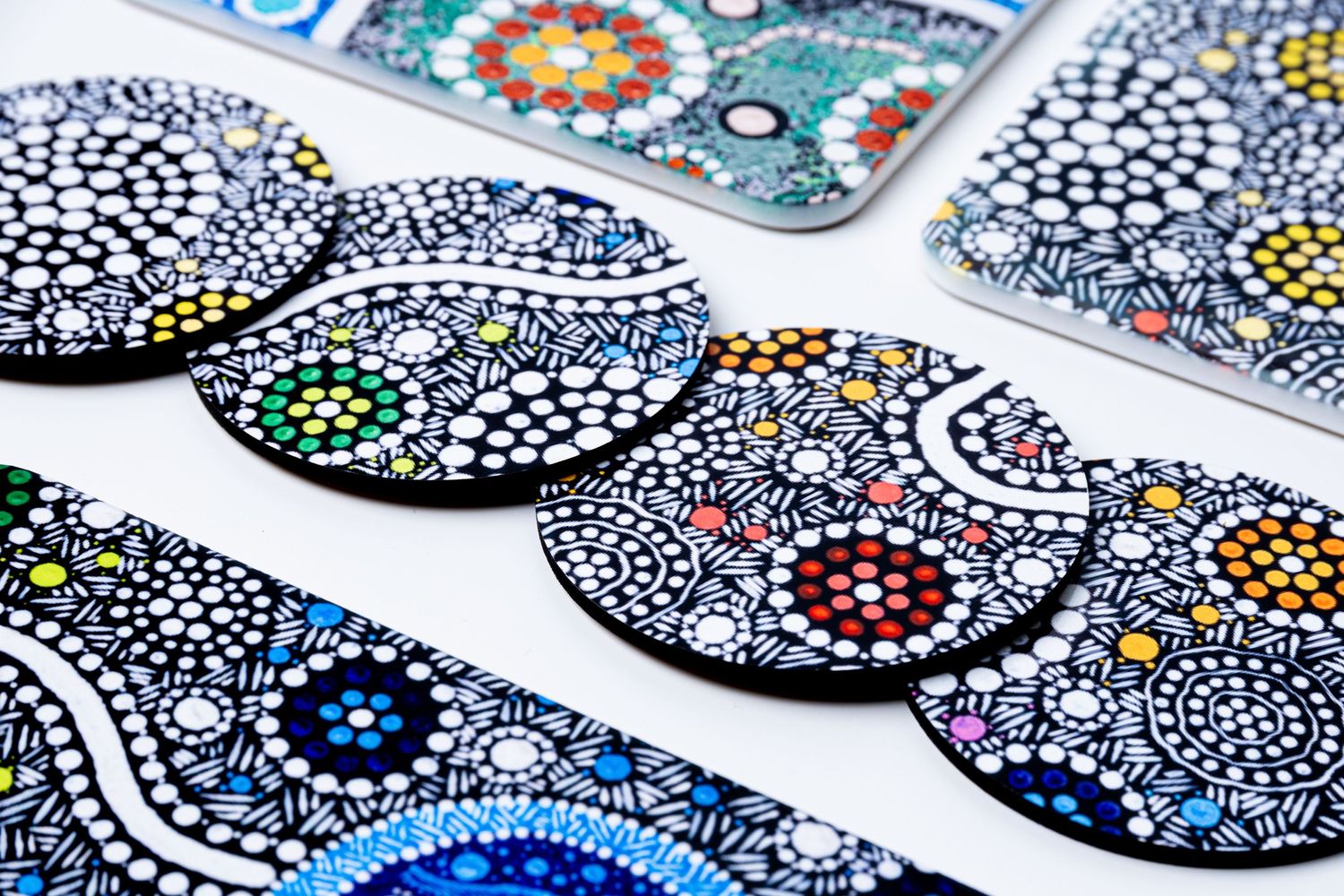 Decorative mosaic coasters featuring intricate blue and white dot patterns.