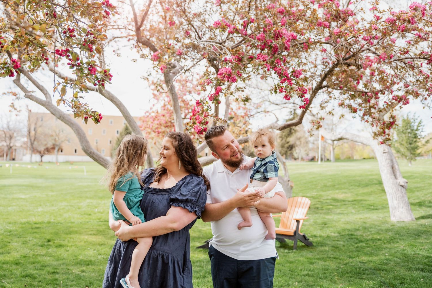 Sweet family portrait session taking place in front of Idaho State University  in Pocatello, Idaho.