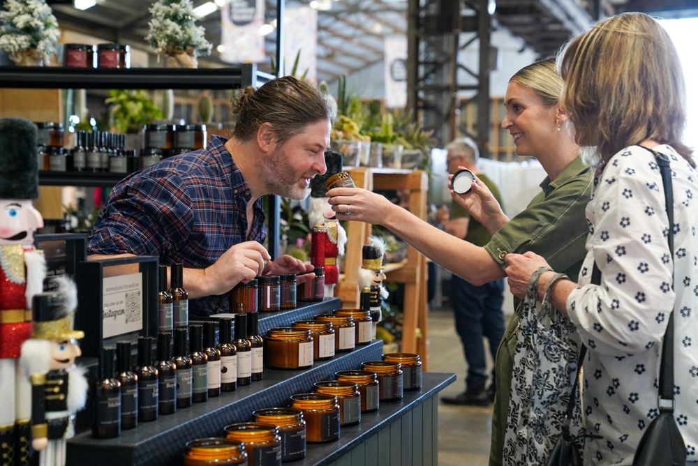 Vendor showcasing products at Makers Markets
