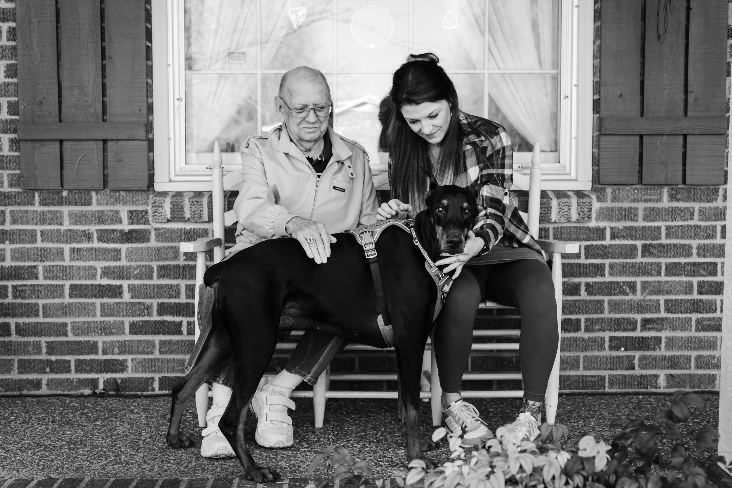 family saying goodbye to their pet on their front porch in Nashville, TN