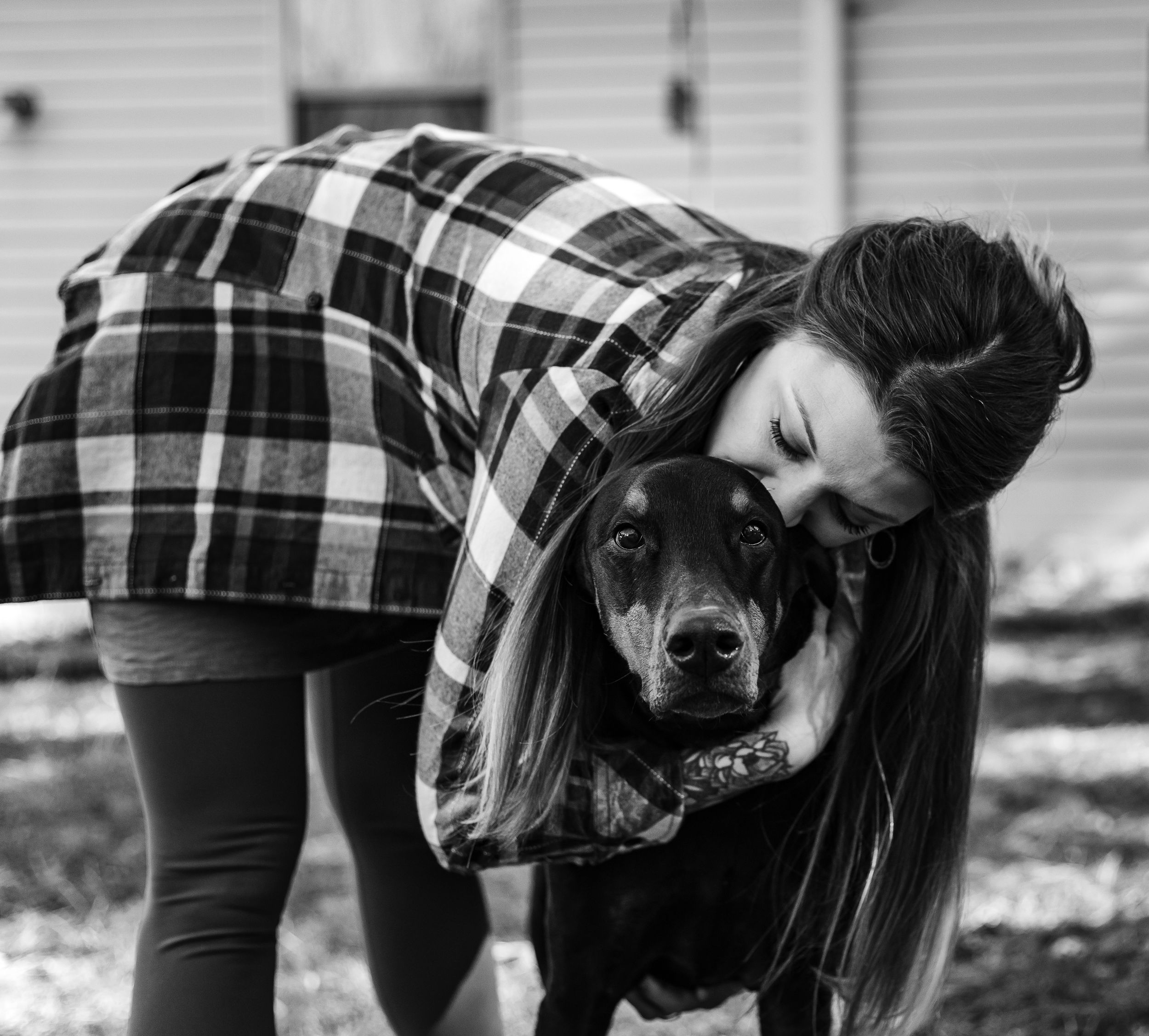 young adult embracing her sick pet