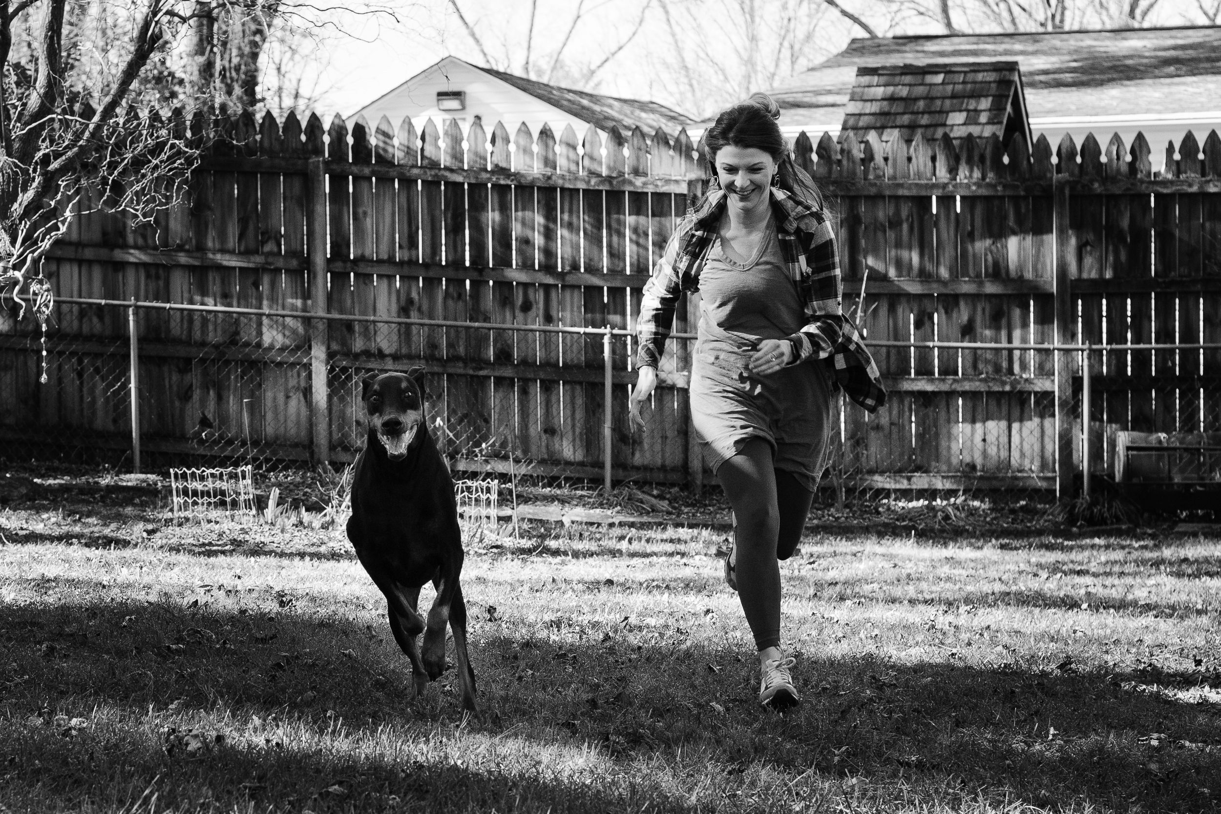 owner and her dog companion playing together at home