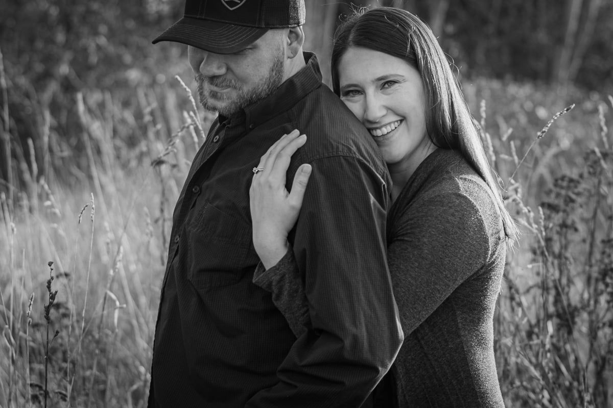 Black and white photo of engaged couple outdoors