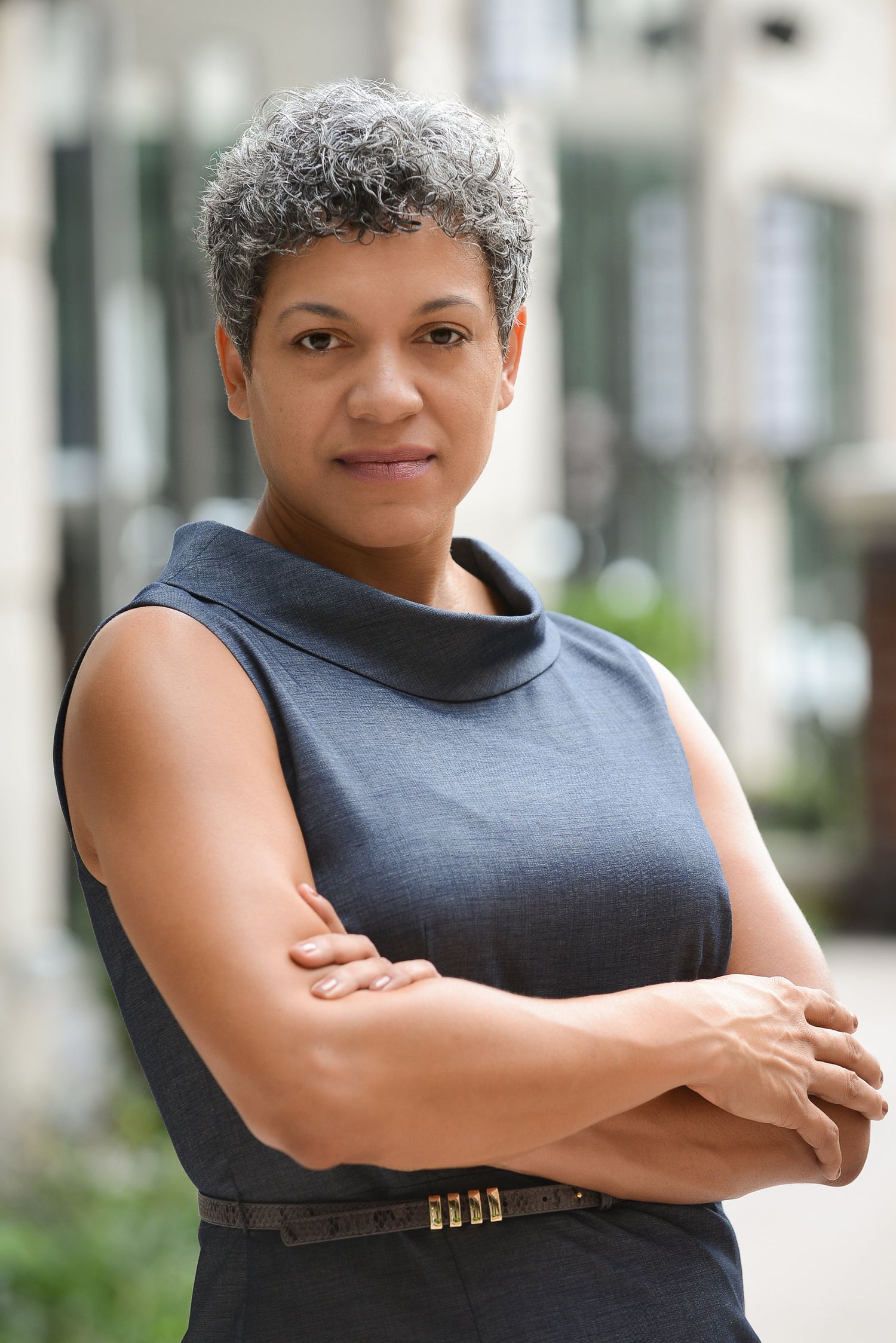 Professional headshot of a powerful female executive exuding confidence