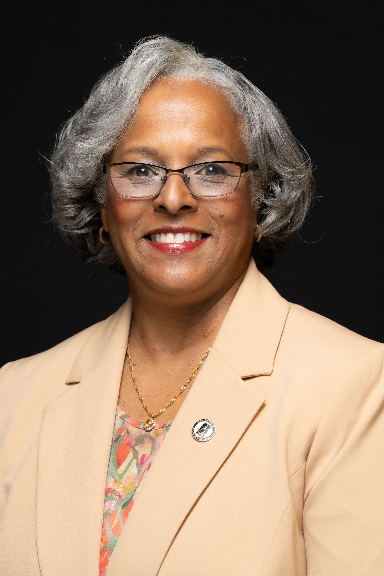 A captivating headshot of a female business owner, radiating determination
