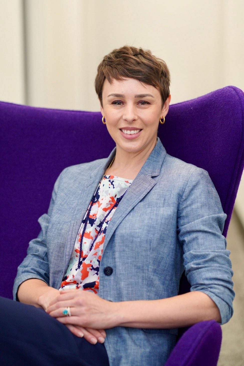 Candid professional headshot of a businesswoman, displaying authenticity and passion