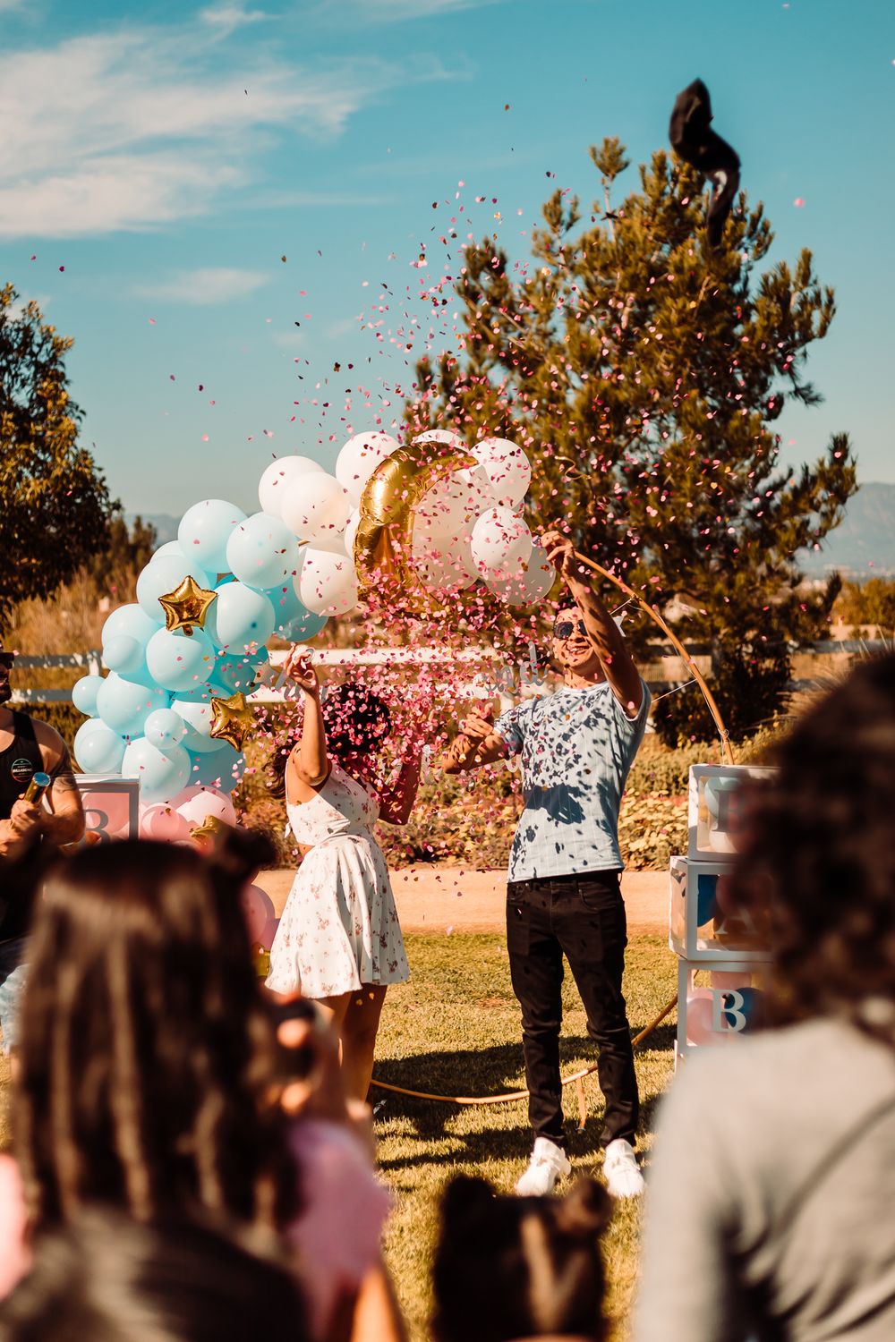 balloon confetti gender reveal event photography at park in Chino Hills, California