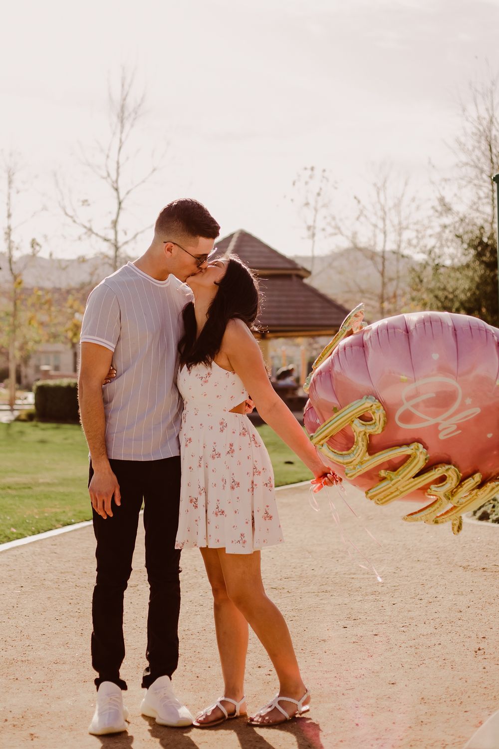 gender reveal announcement photography of couple with gender announcement balloon in Chino Hills, California