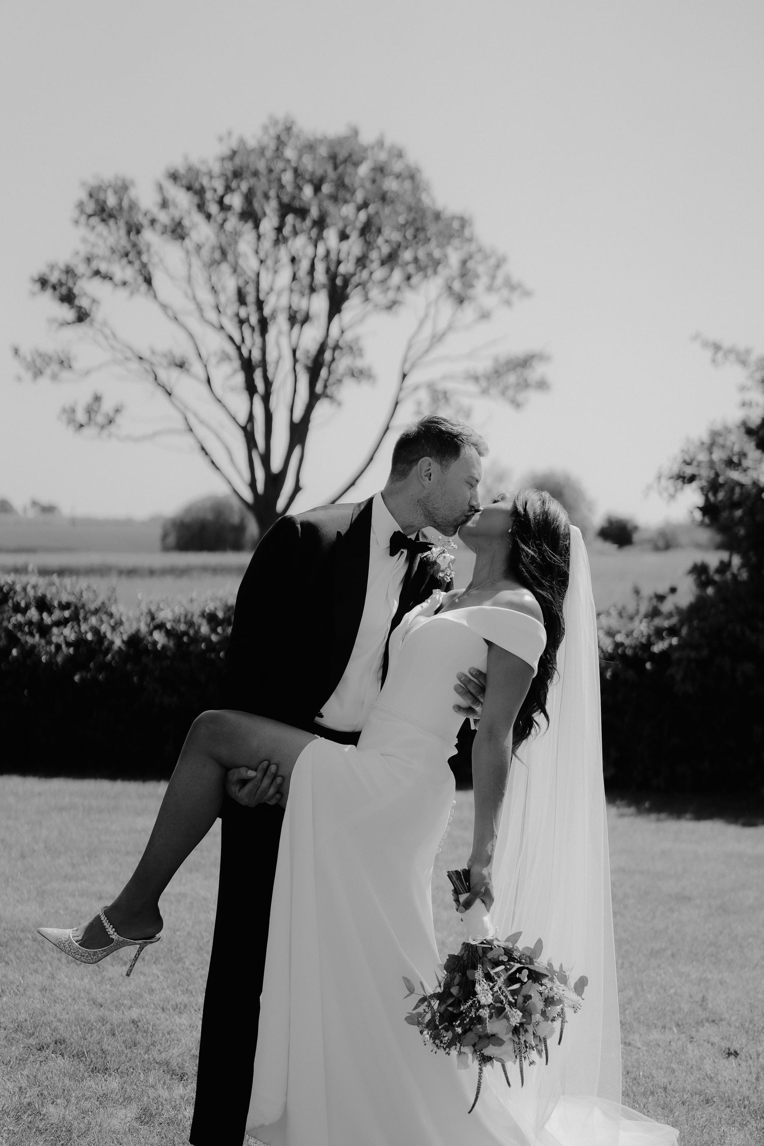 bride-and-groom-kissing-stockton-house-wedding-shropshire