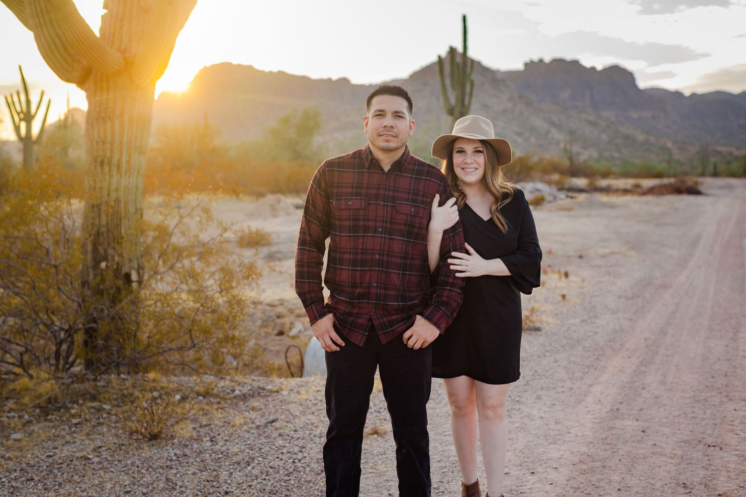 Family embracing at sunset in mountain landscape Arizona