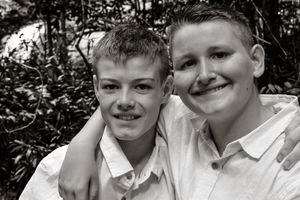 Candid black and white portrait showing natural expressions and laughter.