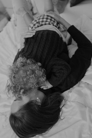 Black and white intimate portrait creating a tender moment between loved ones.