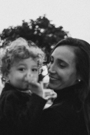 Black and white portrait showing gentle intimacy in warm afternoon light.
