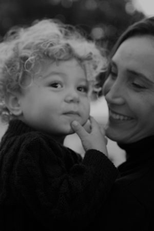 Intimate black and white close-up capturing tender family affection.