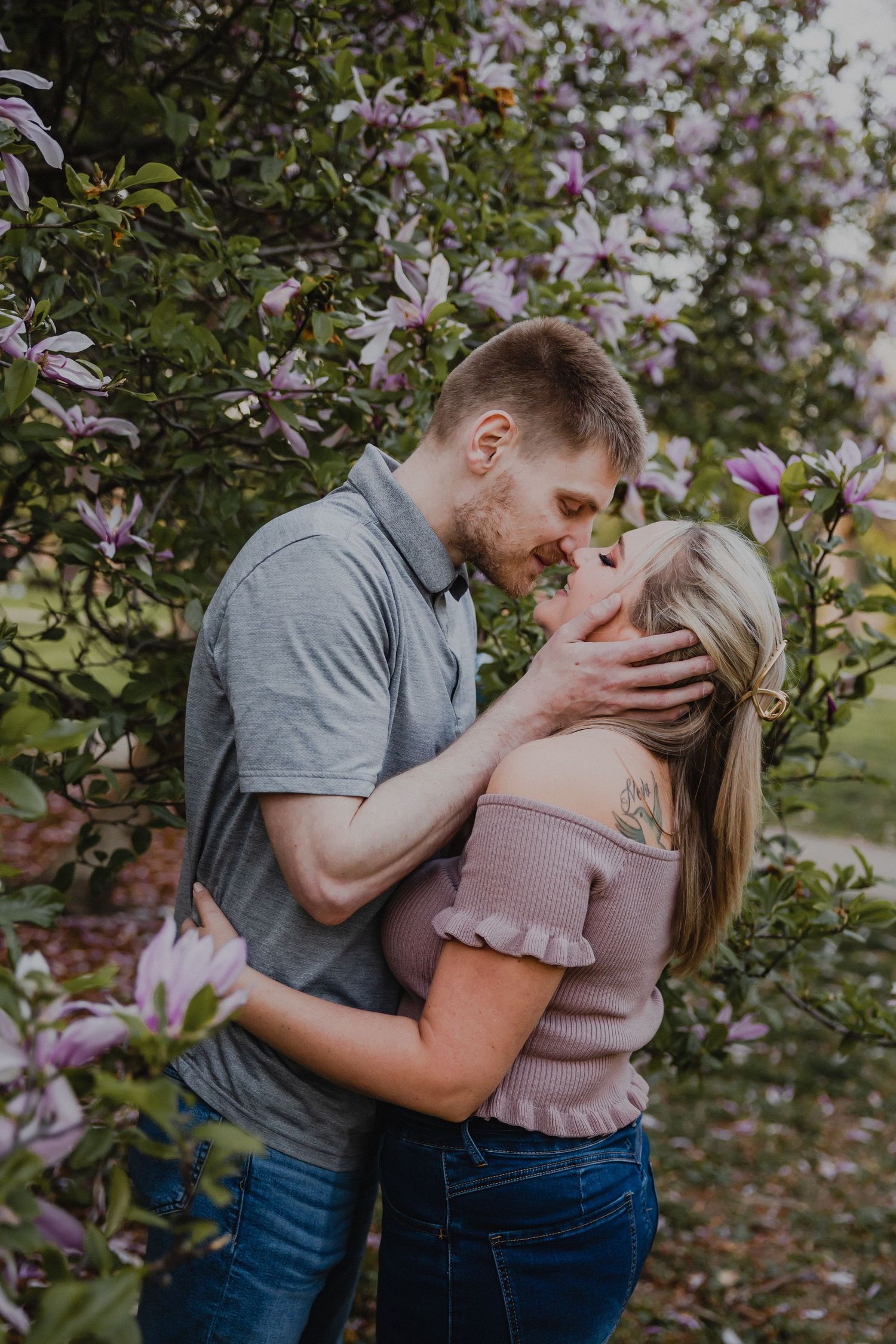 A romantic spring moment among blooming magnolia flowers.