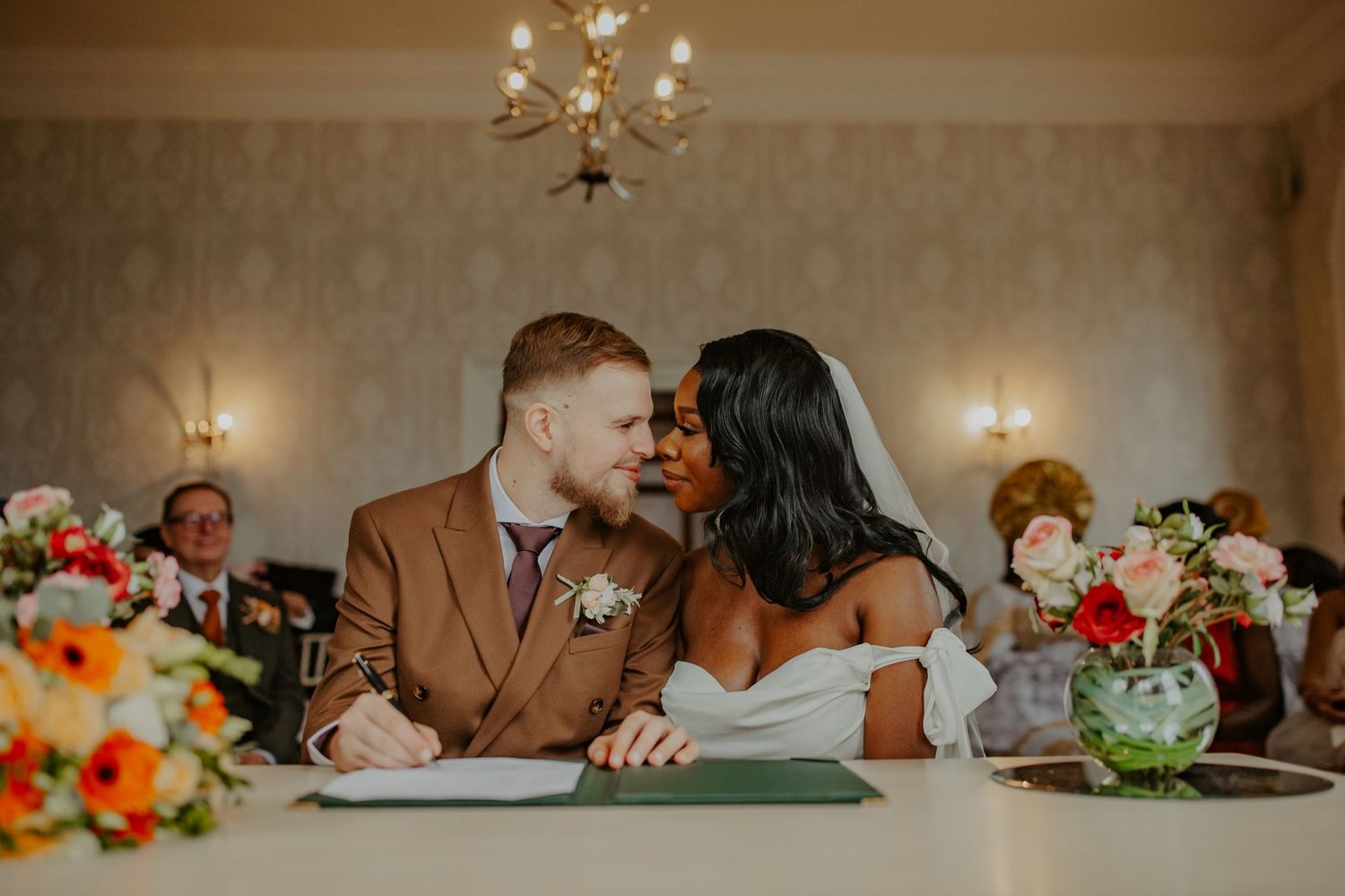Bride and Groom signing the registry at their wedding at Morden Park House - London - RELM Photography