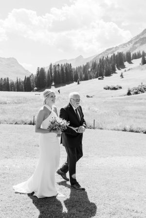 Mountain landscape provides majestic backdrop for wedding processional.