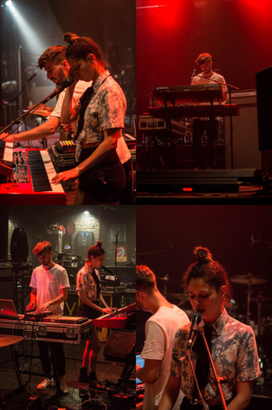 Musicians perform on stage with synthesizers and keyboards under dramatic red and white lighting.