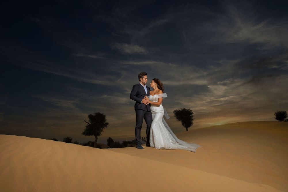 Romantic couple photography session at sunset in Dubai desert