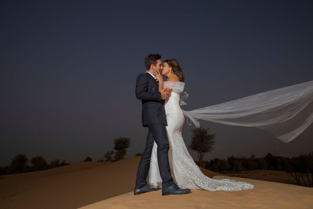 Romantic couple photography session at sunset in Dubai desert