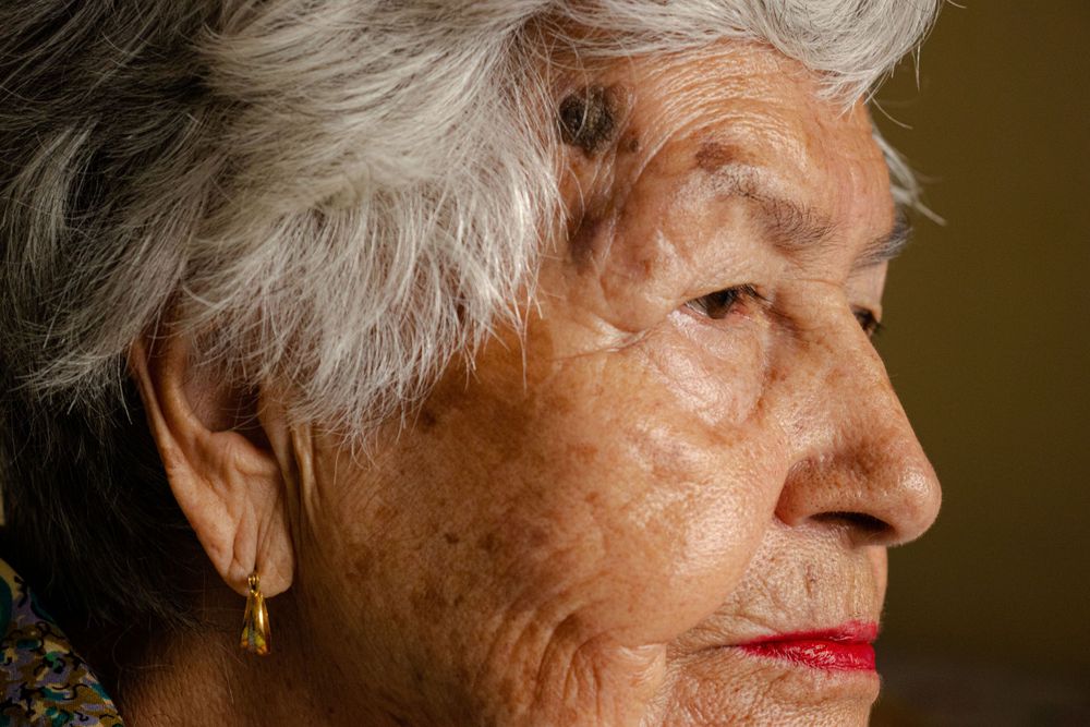 Close-up profile shots capturing silver hair and facial features.