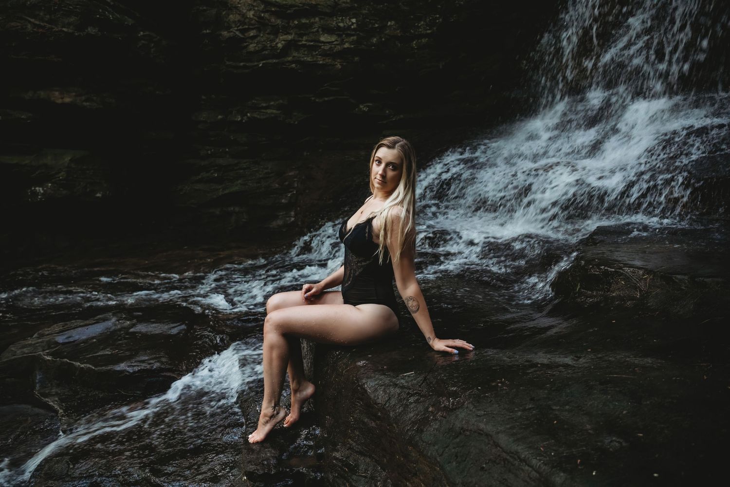 Artistic waterfall photography series with flowing water and dark rocky backgrounds.