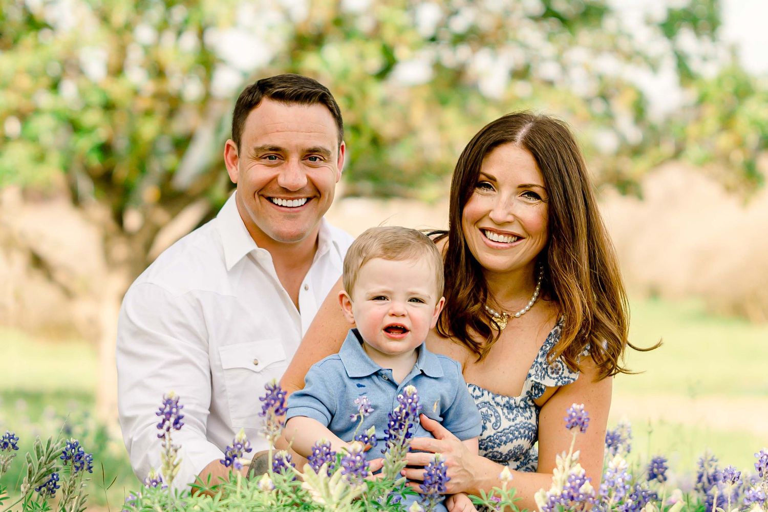 family photos in a field of bluebonnets in houston texas