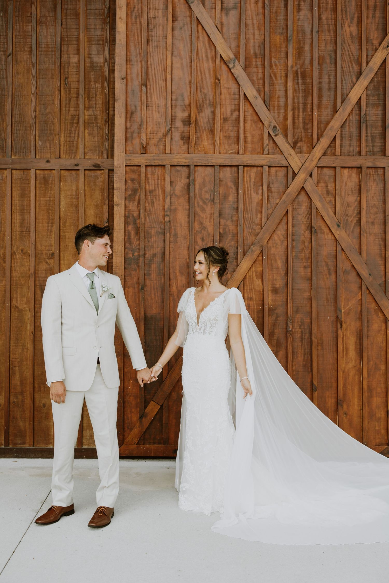 Bride and groom first look photos at barn wedding in Okeechobee, Florida at Ever After Farms Stockyard captured by Lindsay McDow Photography
