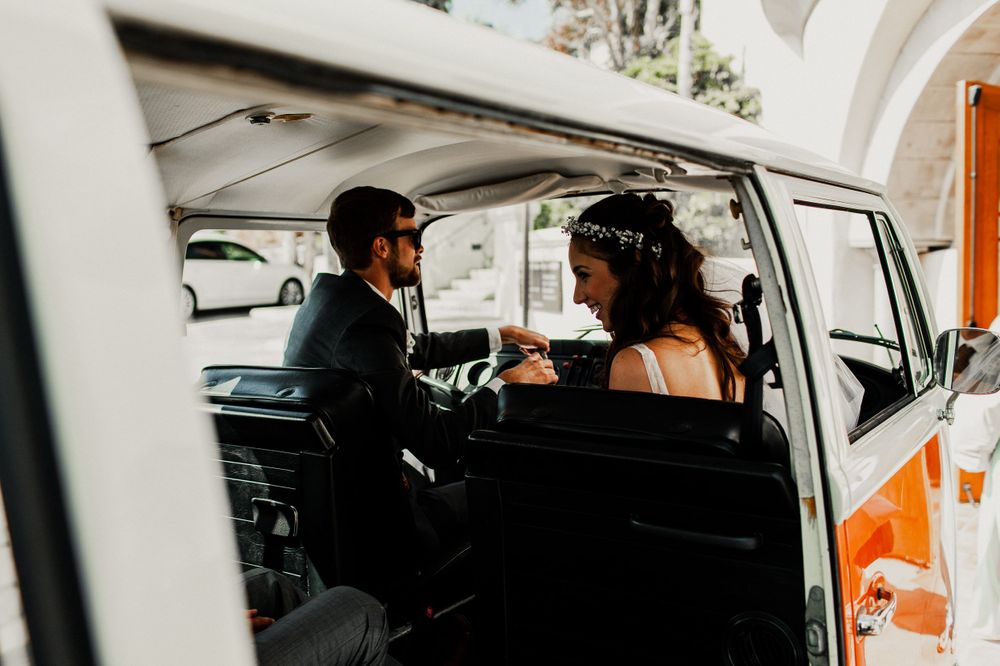 bride and groom inside volkswagon van