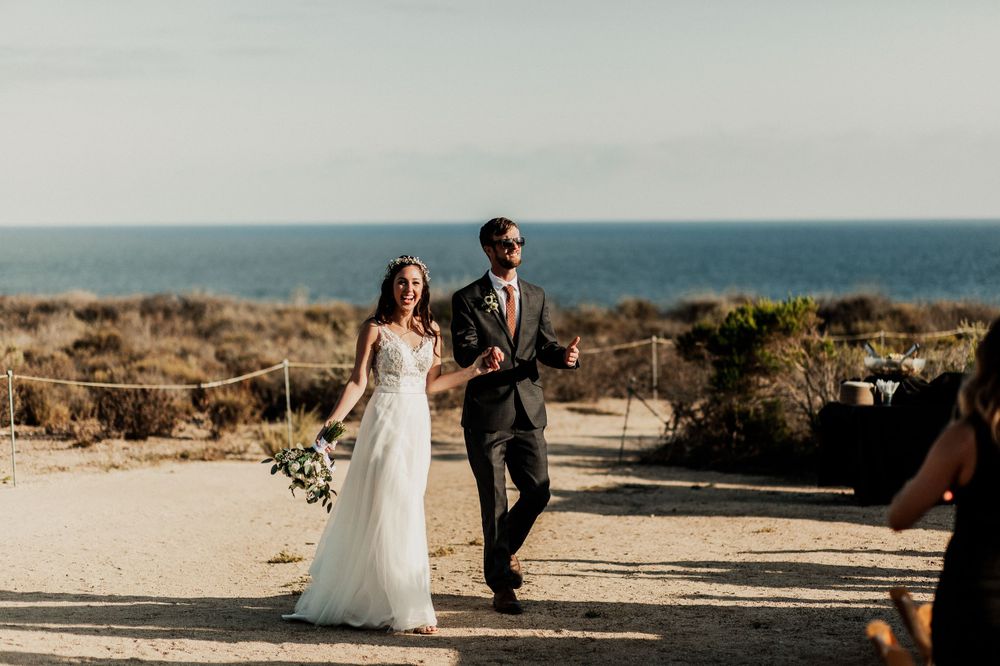 bride and groom walking to their reception at crystal cove