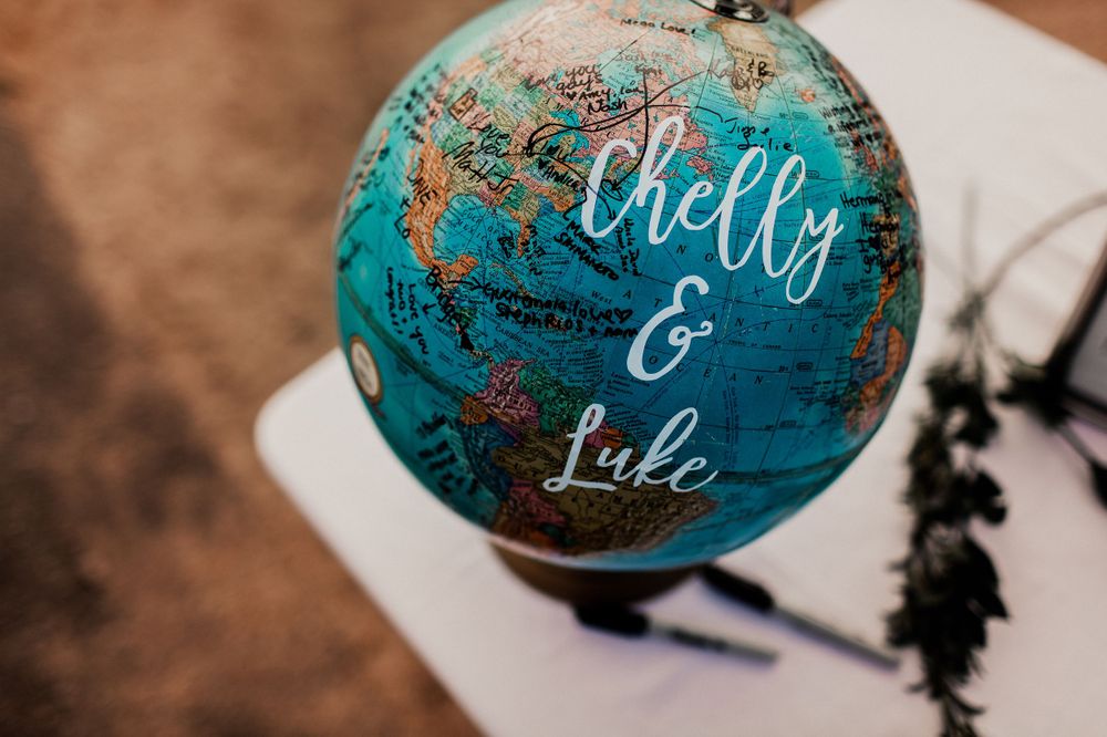 chelly and luke globe sign in at reception decor