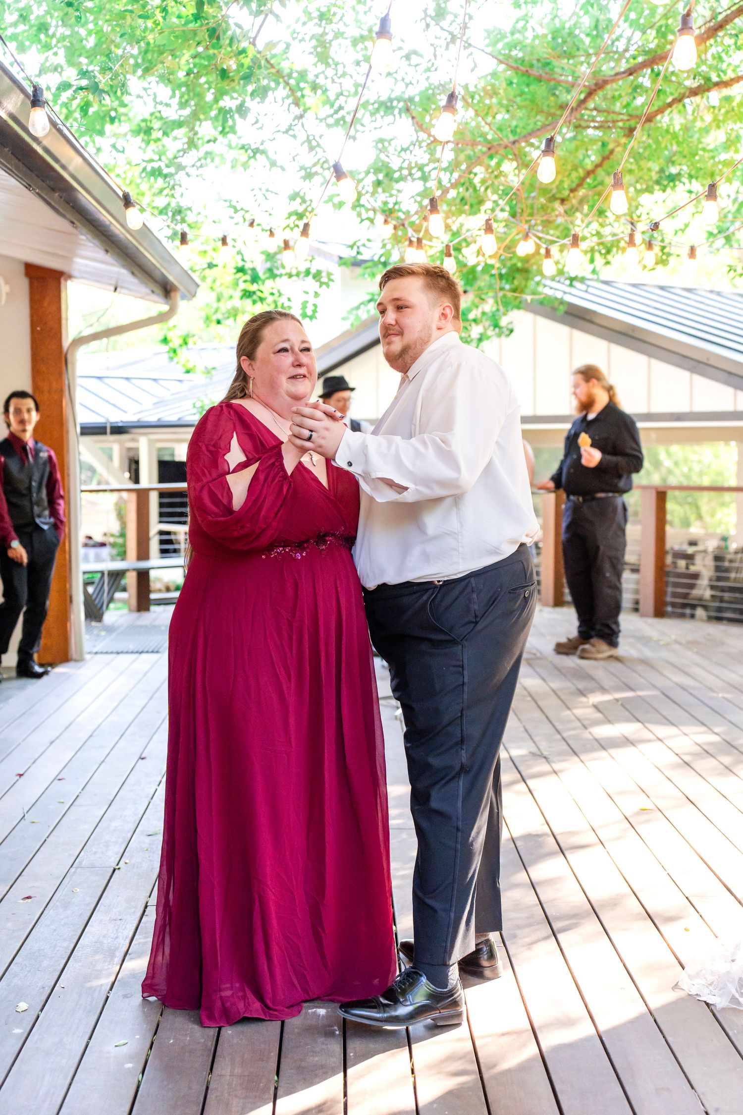 groom dances with his mom for mother son dance