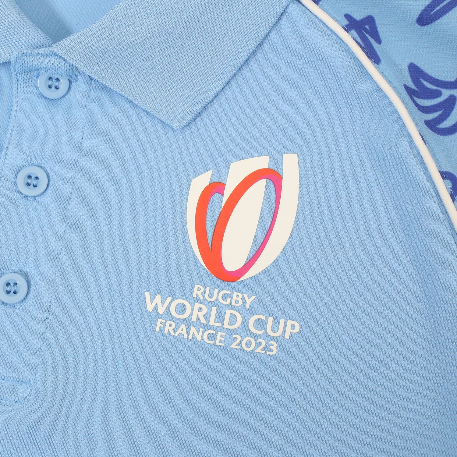 Official Rugby World Cup France 2023 logo embroidered on light blue polo shirt.