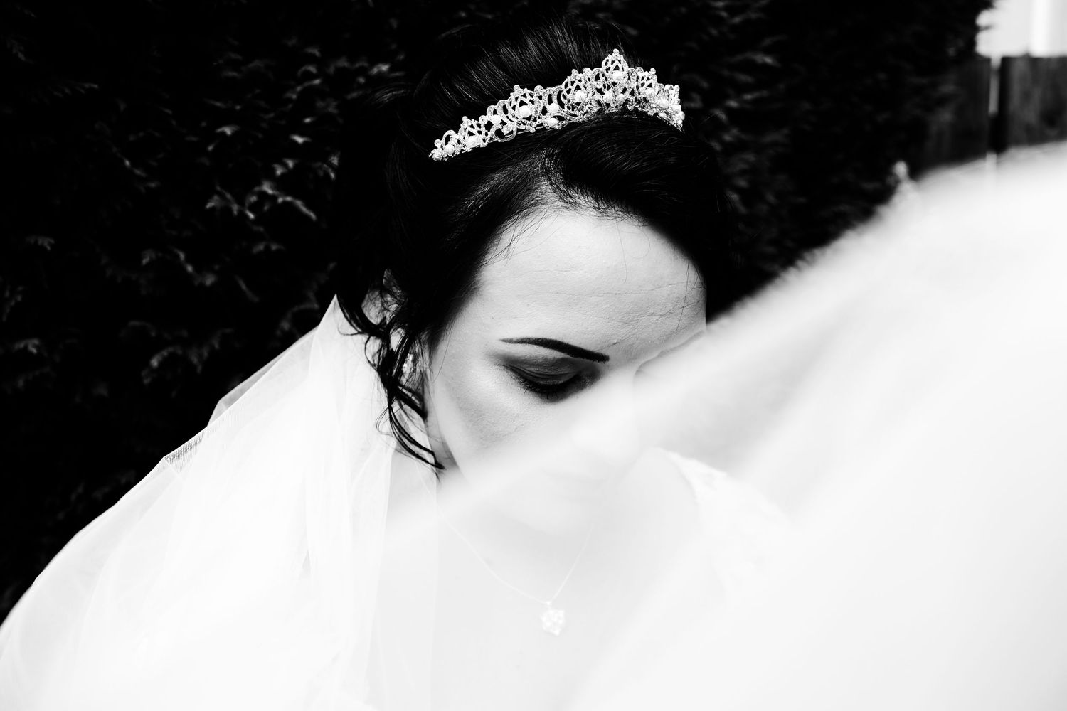 Elegant individual portrait of bride with veil creatively swooping around her. Walsall, West Midlands wedding.