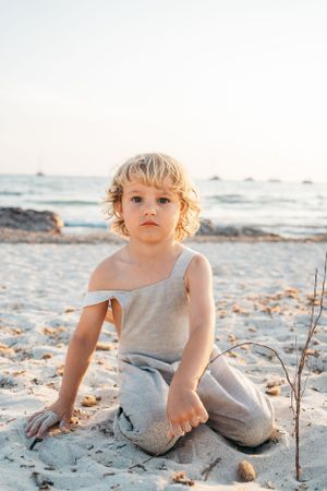 a boy sat on the beach in es Trenc, Mallorca