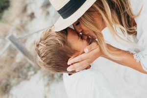 Mum kissing her son in Mallorca