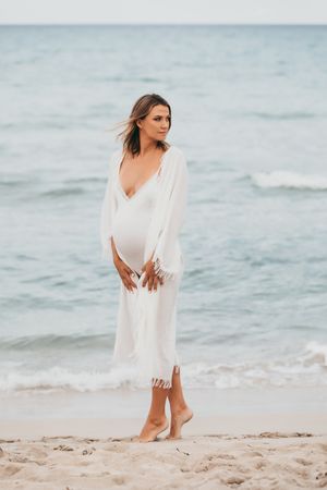 a pregnant woman in the beautiful light in Playa de Muro in Mallorca