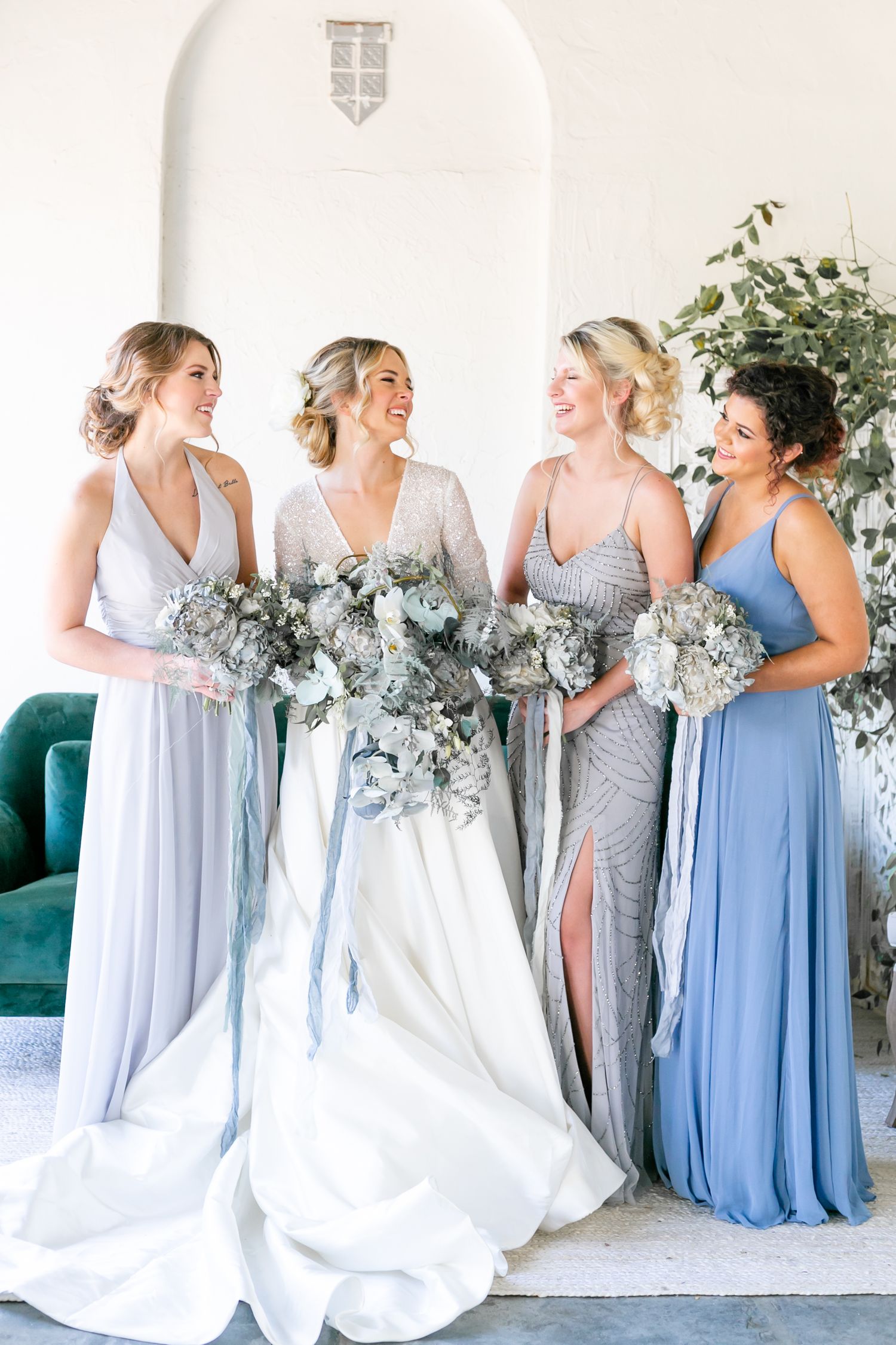 bride and bridesmaids laugh with a wedding planner in baton rouge