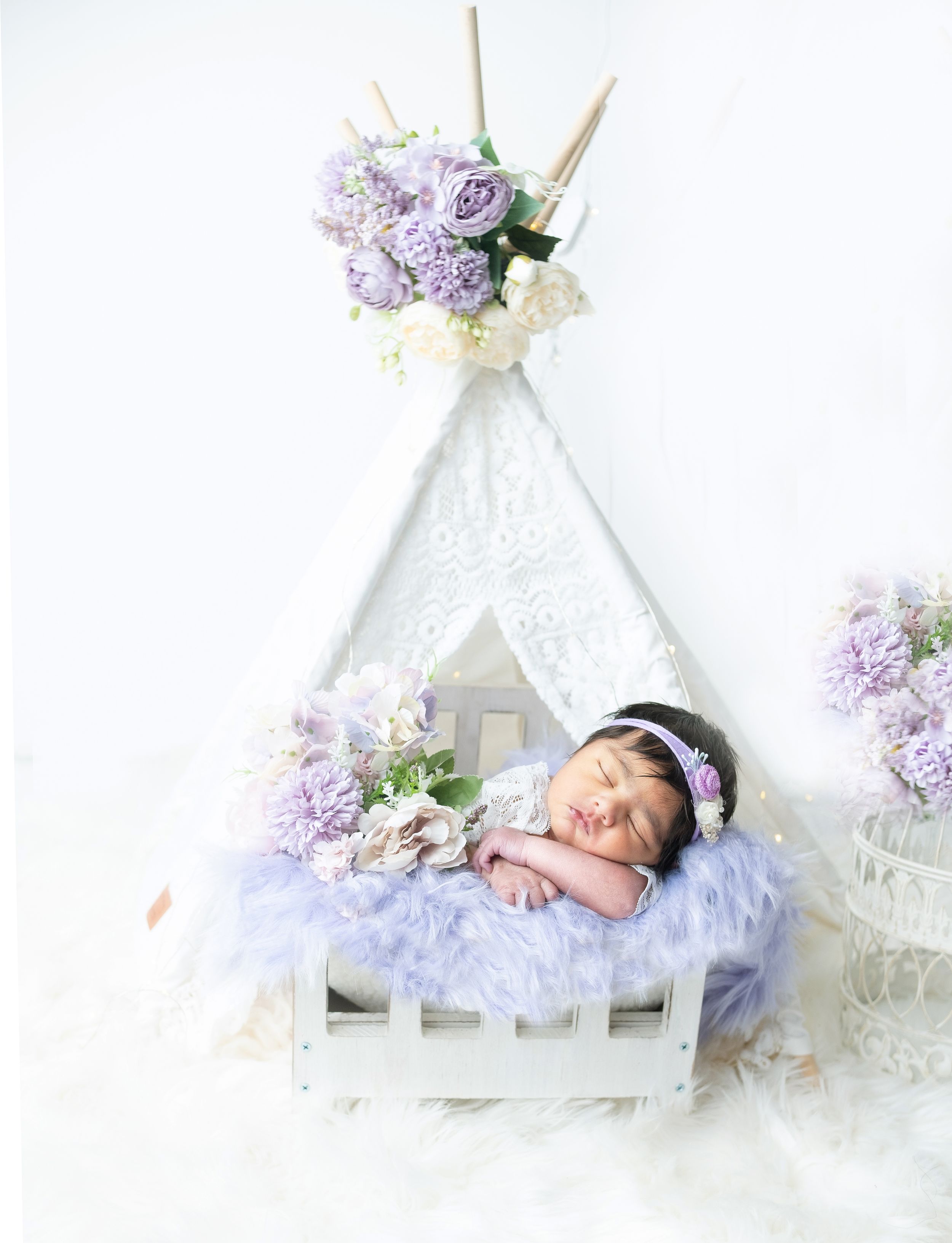 new born baby sleeping with sky blue dress - Jasmeet K Photography