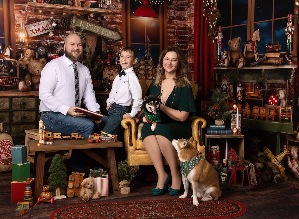 Family posing with Santa during holiday studio portrait session in Austin photography studio