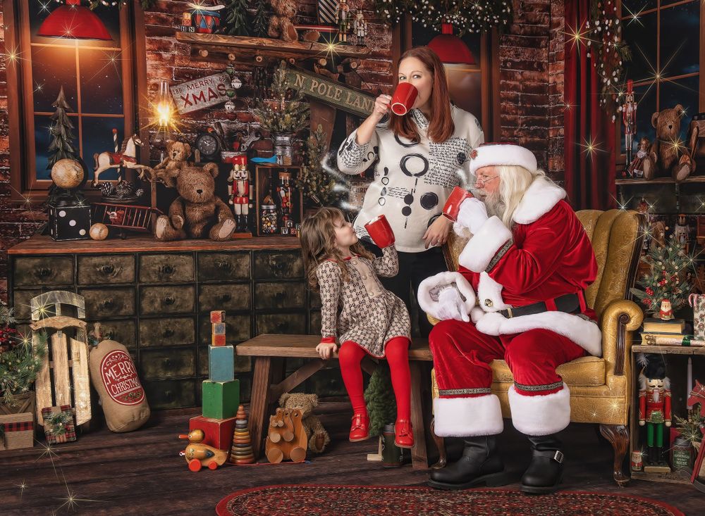 Child standing with Santa during holiday portrait session in festive workshop-style set in Austin studio
