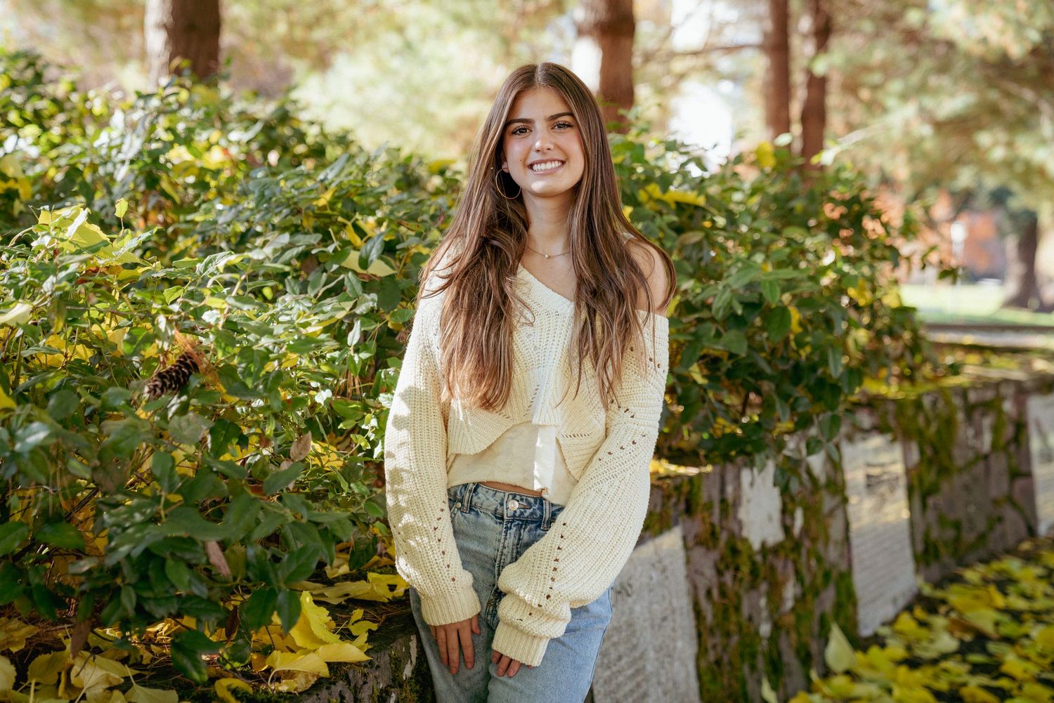 Fall portrait of teen girl in soft light, surrounded by greenery in Portland Oregon, Pacific Northwest vibes.