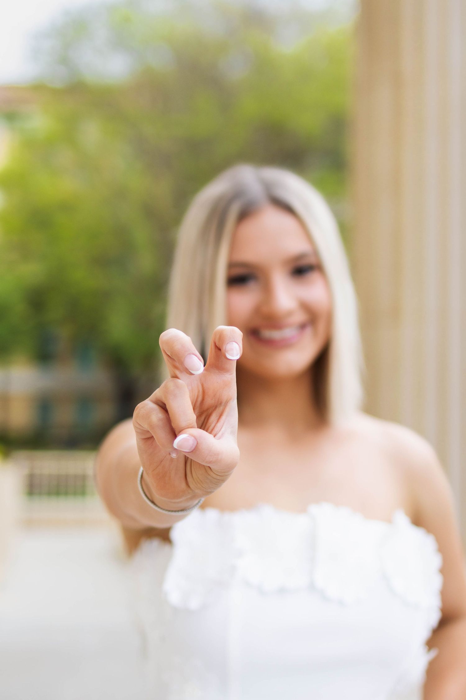 A wedding photography series showing a couple showing their new rings in blurred close-up shots.