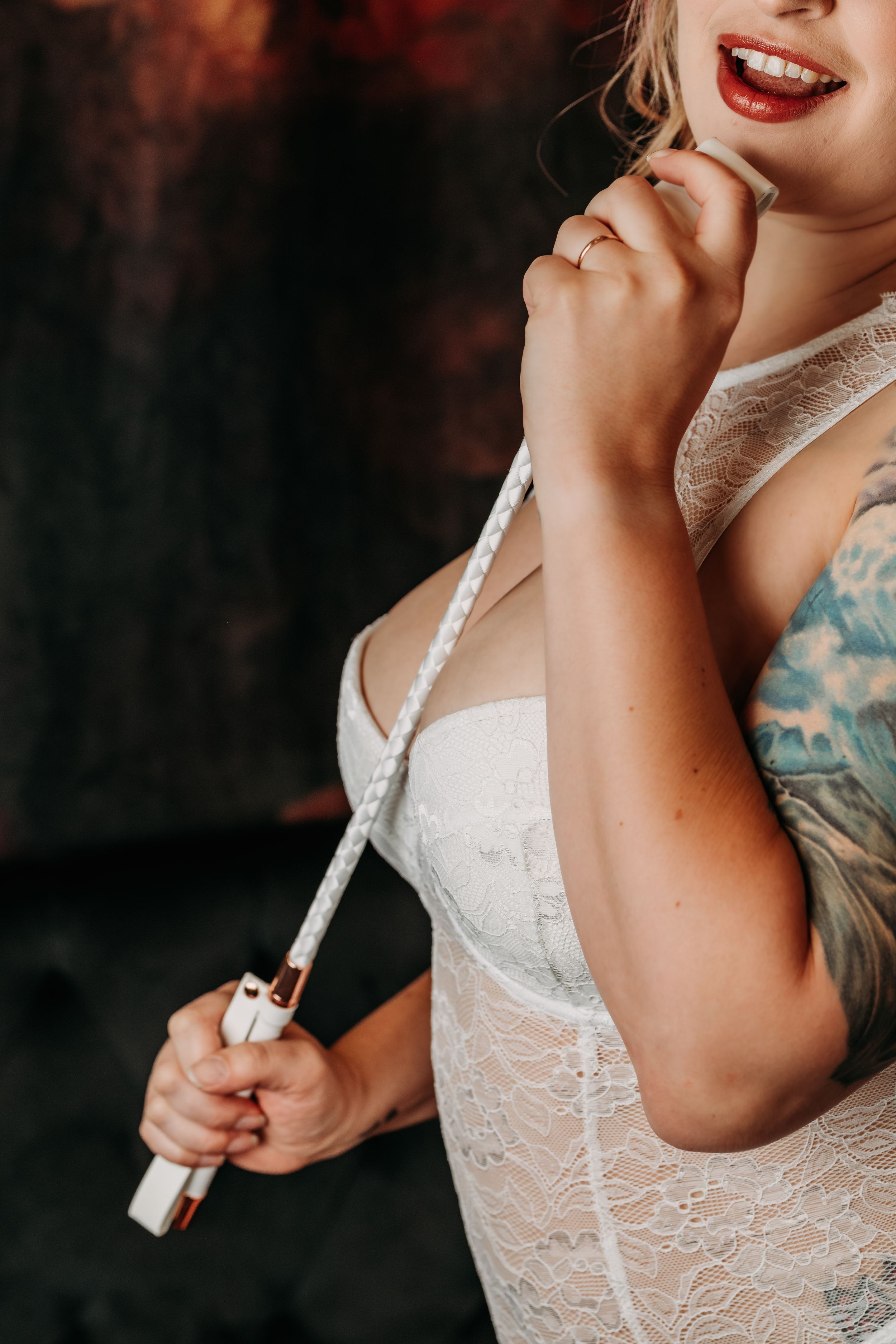 Cropped boudoir portrait showing white lace lingerie and decorative elements. Intimate Boudoir Photographer
