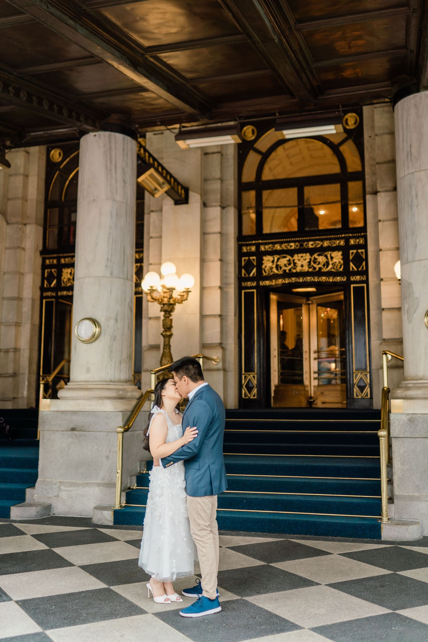 Series of photos showing a romantic dance in a grand columned entrance with checkerboard floors.