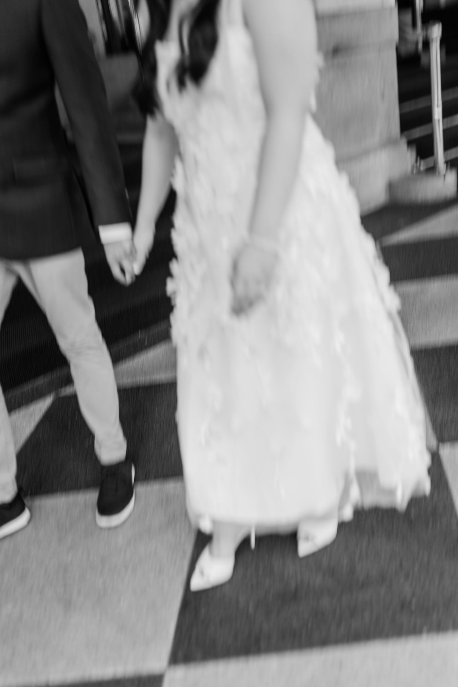 Close-up sequence of feet and dress details during an intimate dance moment.